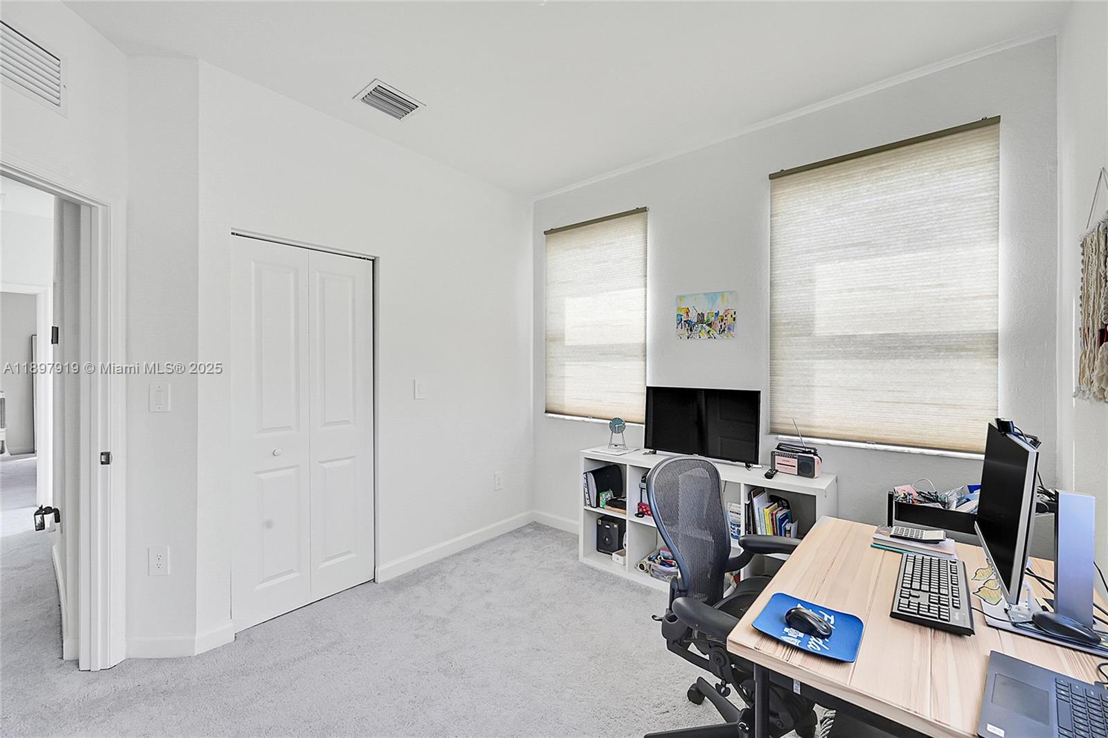 14832 Southwest 265th Street Homestead, FL 33032 - Photo 27 of 43 a view of a workspace with furniture and a window