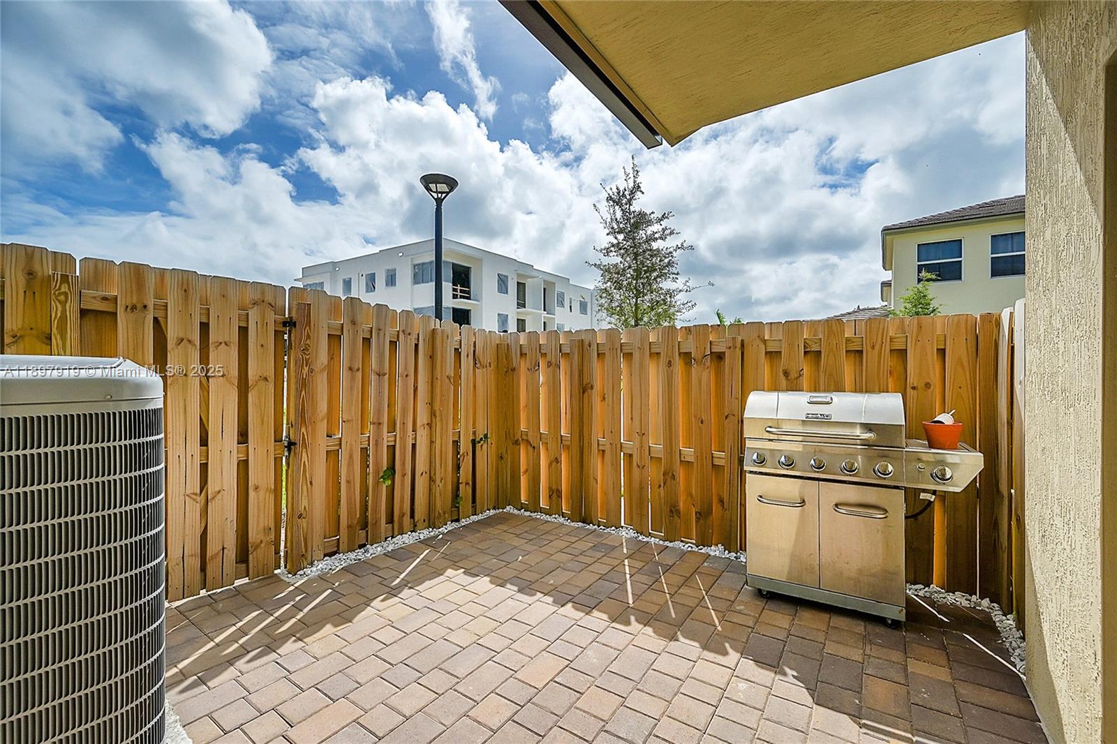 14832 Southwest 265th Street Homestead, FL 33032 - Photo 34 of 43 a bathroom with a granite countertop sink and washing machine