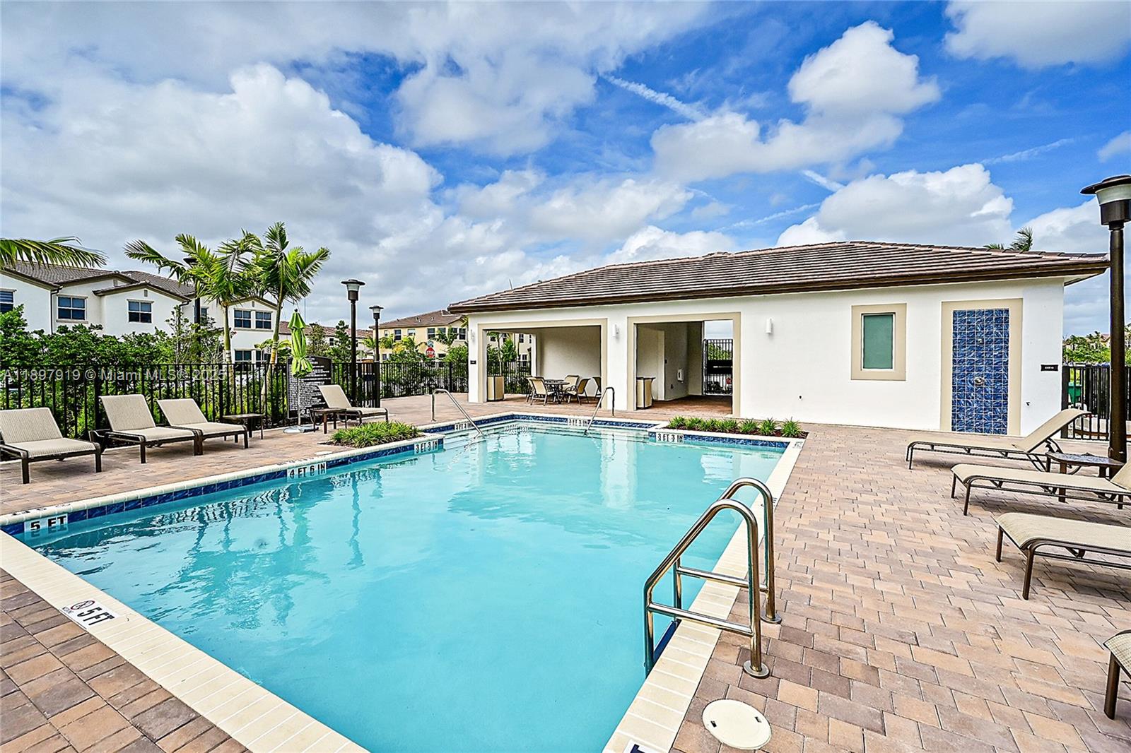 14832 Southwest 265th Street Homestead, FL 33032 - Photo 41 of 43 a view of a patio with swimming pool table and chairs