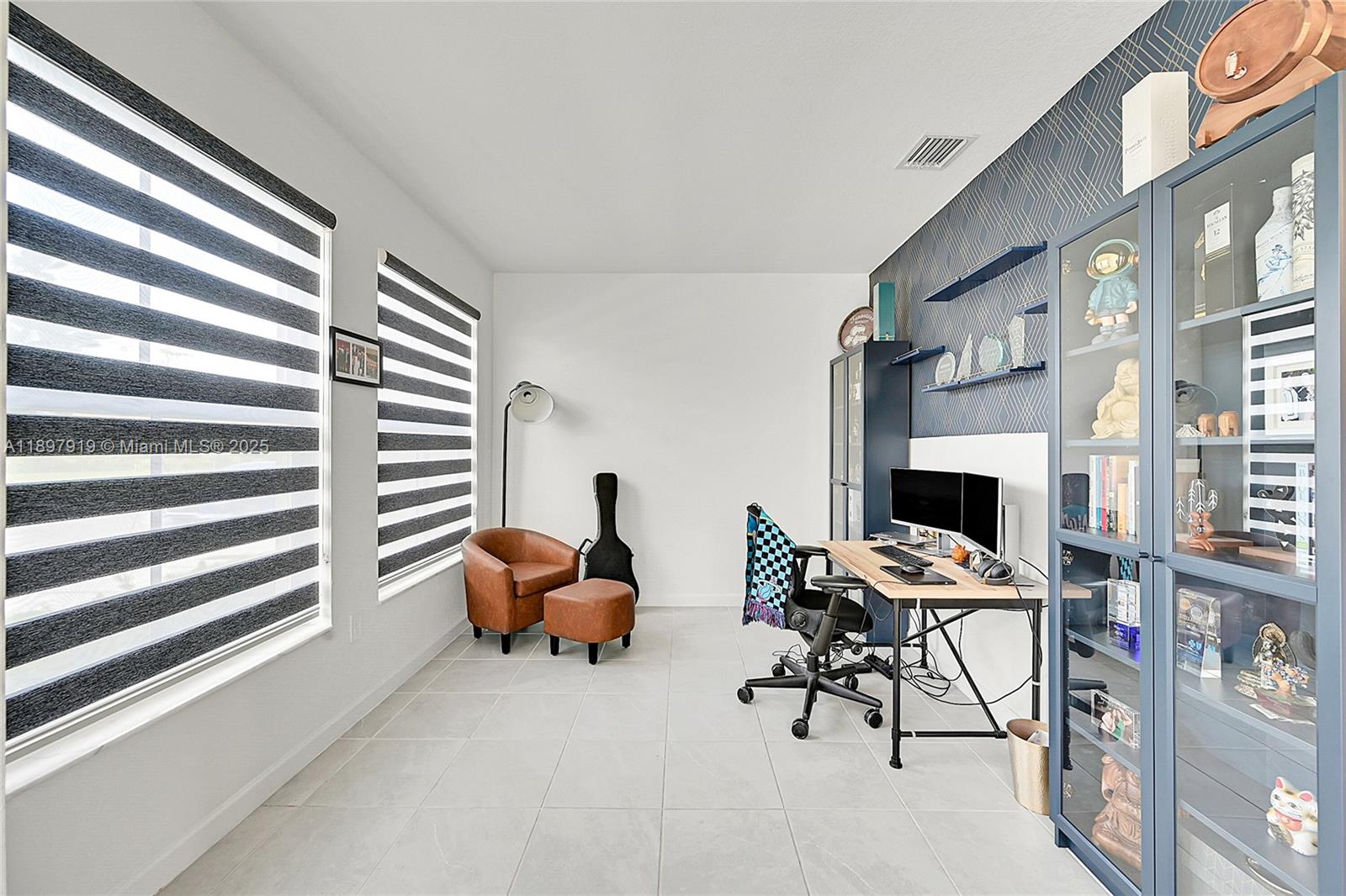 14832 Southwest 265th Street Homestead, FL 33032 - Photo 6 of 43 a reading room with furniture and a fireplace