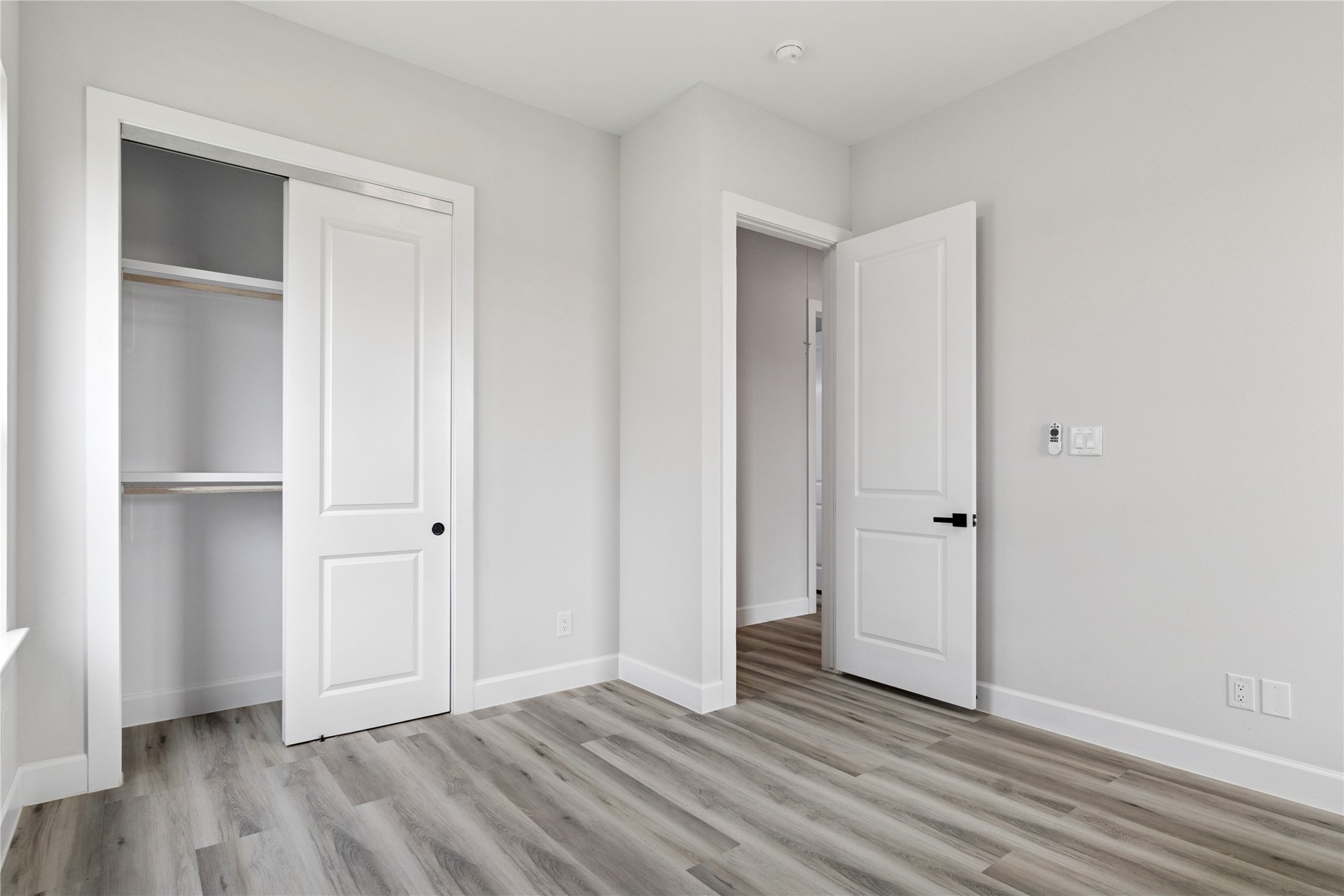 5766 Ward Bend Road Sealy, TX 77474 - Photo 22 of 45 a view of an empty room and wooden floor