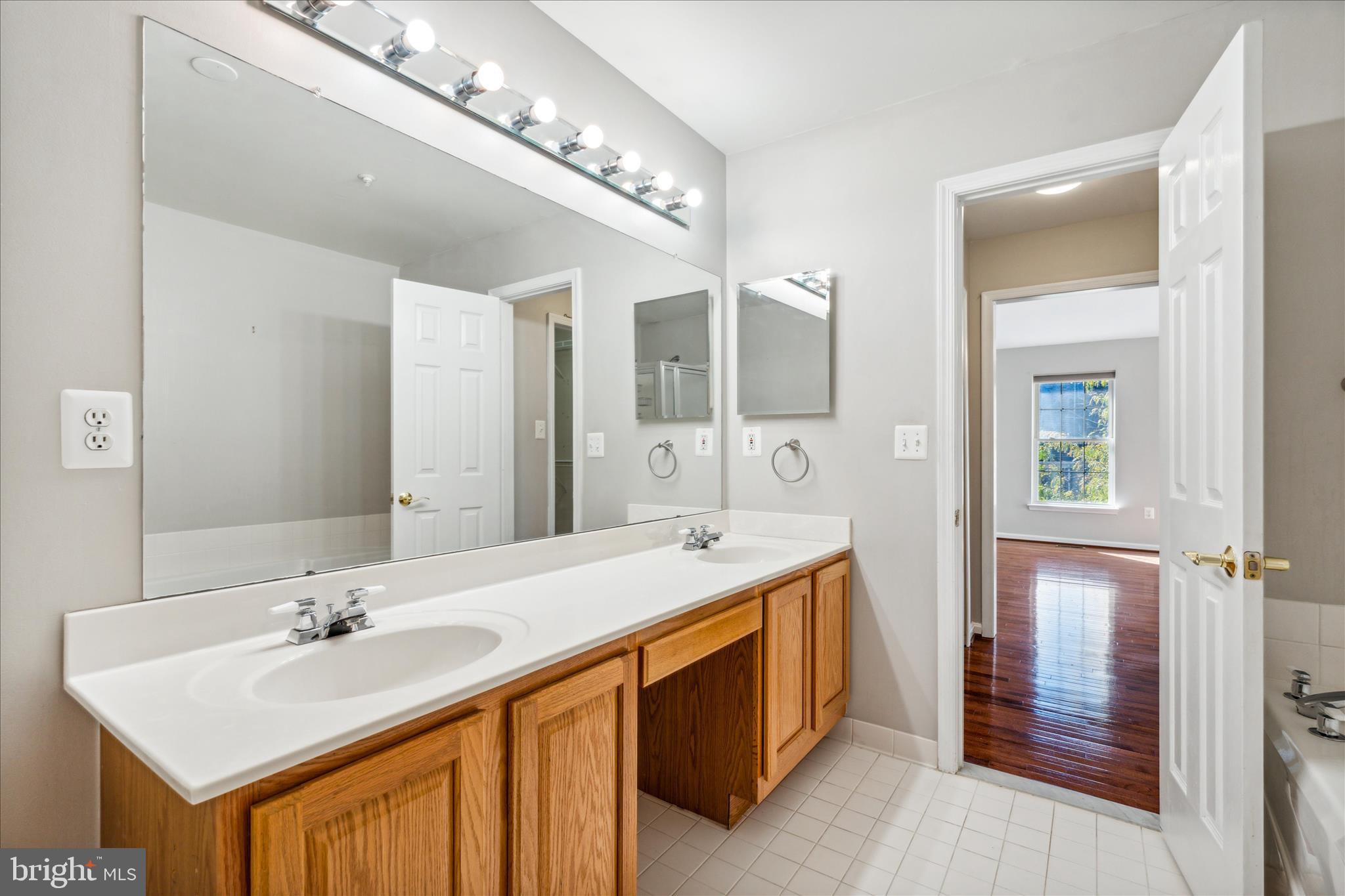 2442 Rippling Brook Road Frederick, MD 21701 - Photo 37 of 85 a bathroom with a sink and a mirror