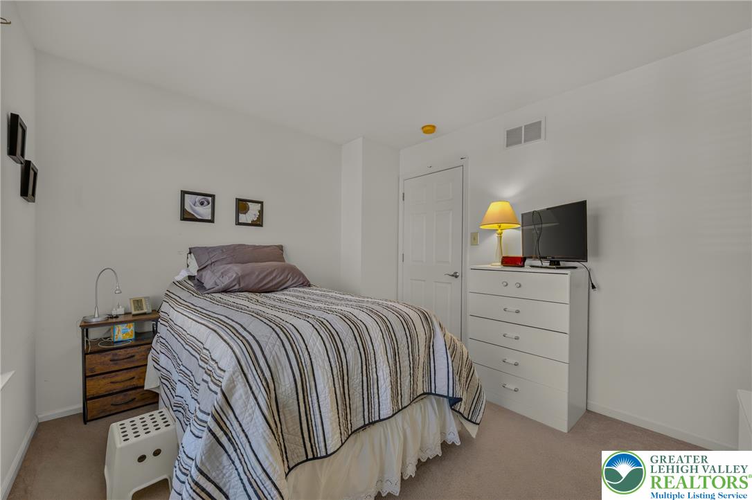 1702 Red Bud Road Quakertown, PA 18951 - Photo 45 of 68 A well-lit bedroom provides comfortable repose and features light-colored carpeting.