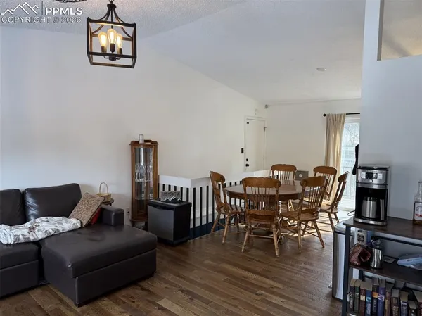 a view of a livingroom with furniture and gym equipment