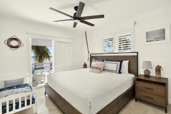 a bedroom with a bed and a table in it