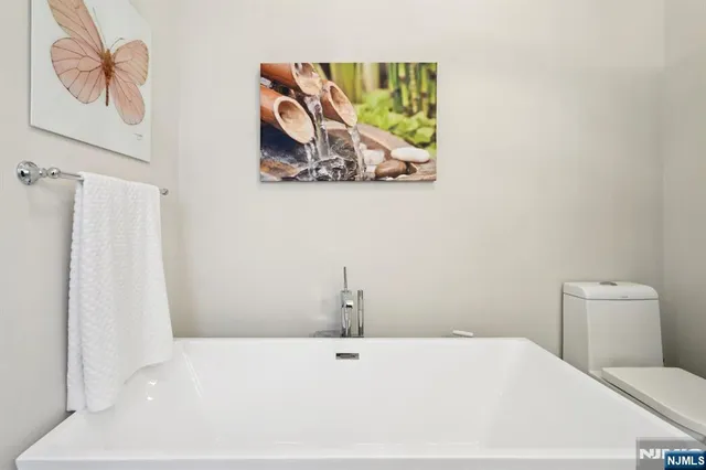a bathroom with a toilet and a sink