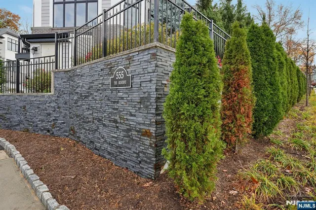 a brick building with a yard