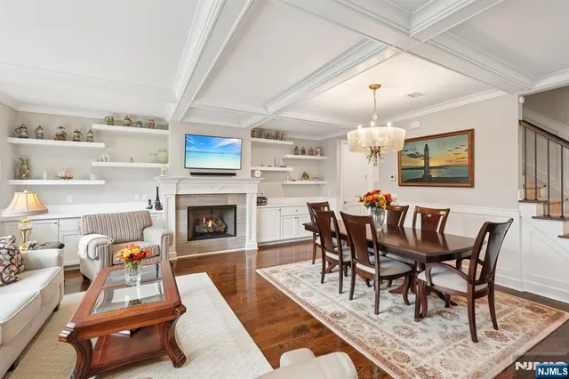 a view of a dining room with furniture and a fireplace