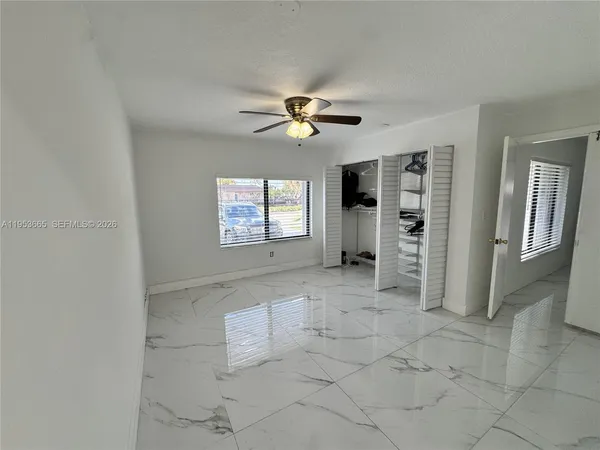a view of an empty room with a window