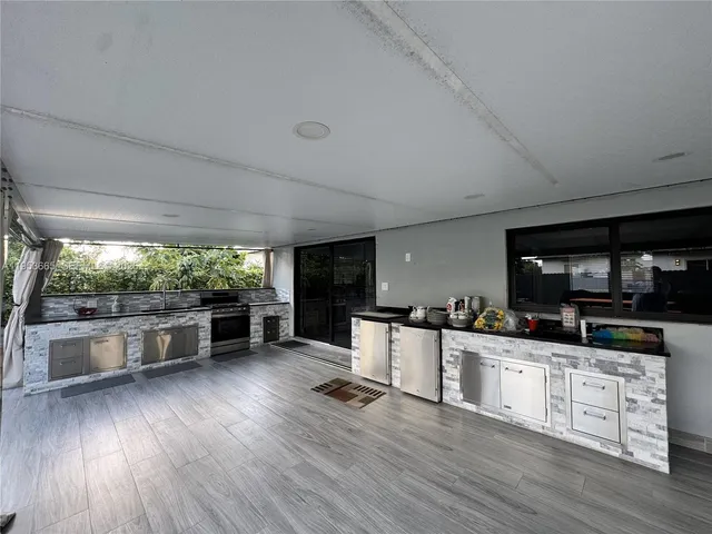 a view of a kitchen with washer and dryer
