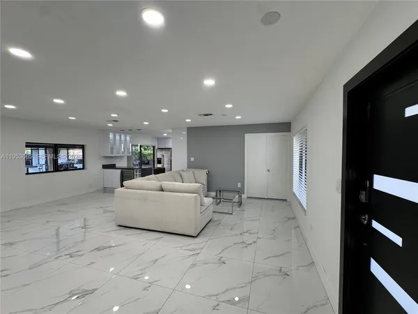 a living room with a couch and a large window