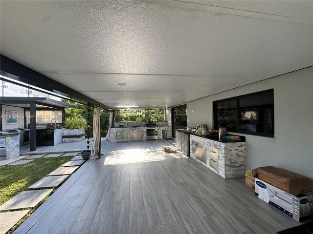 a view of a chairs and tables in the balcony