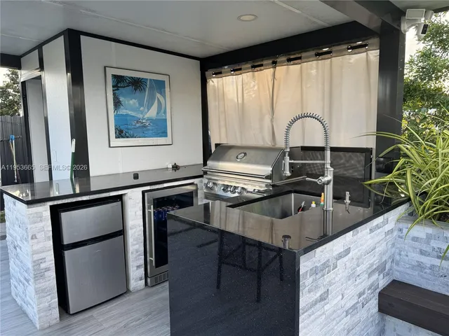 a stove sitting inside of a kitchen