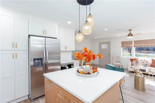 a kitchen with a dining table and chairs