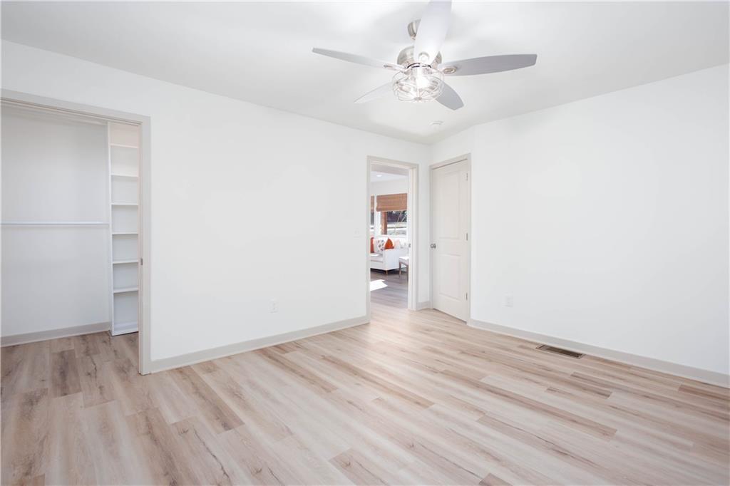 1560 North Columbia Place Decatur, GA 30032 - Photo 18 of 50 a view of an empty room with wooden floor