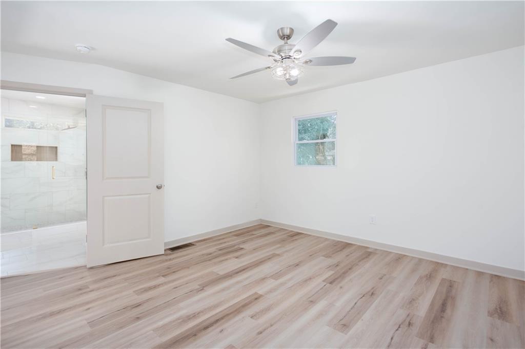 1560 North Columbia Place Decatur, GA 30032 - Photo 19 of 50 a view of an empty room with wooden floor