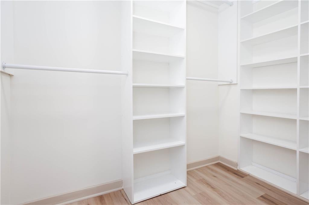 1560 North Columbia Place Decatur, GA 30032 - Photo 20 of 50 a view of walk in closet with empty racks