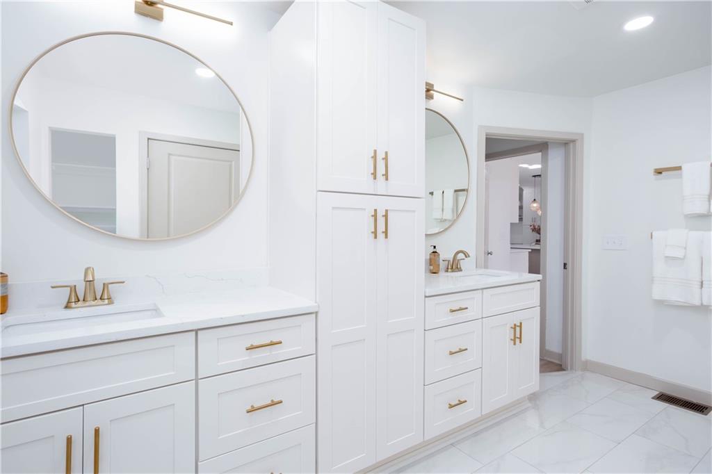 1560 North Columbia Place Decatur, GA 30032 - Photo 22 of 50 a bathroom with a sink vanity and mirror