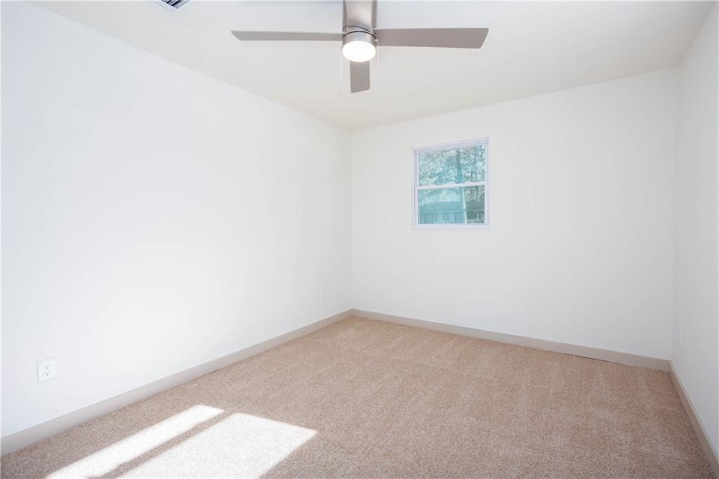 1560 North Columbia Place Decatur, GA 30032 - Photo 30 of 50 an empty room with a window