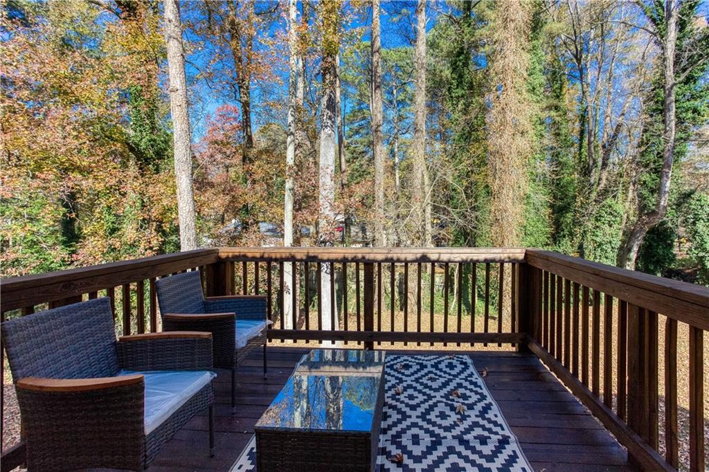 1560 North Columbia Place Decatur, GA 30032 - Photo 36 of 50 a balcony with wooden floor and outdoor seating