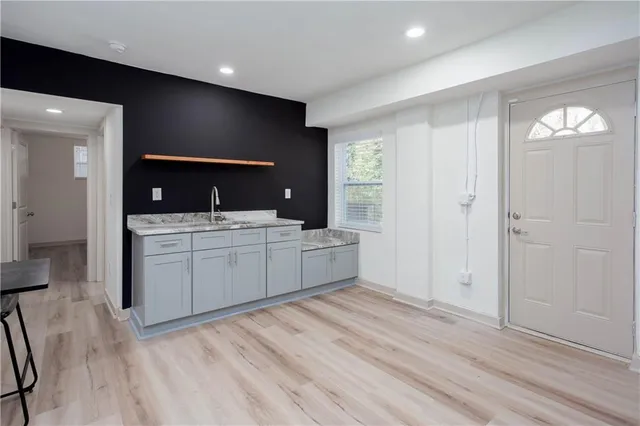 a large bathroom with a double vanity sink and mirror