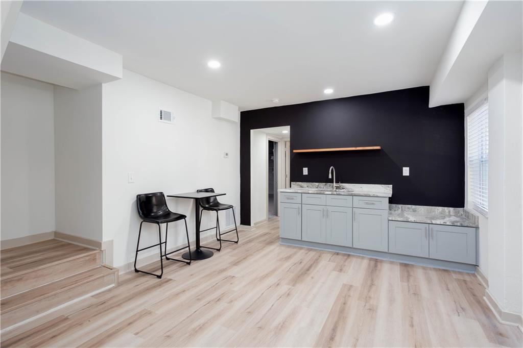 1560 North Columbia Place Decatur, GA 30032 - Photo 39 of 50 a view of a living room filled with furniture and a flat screen tv