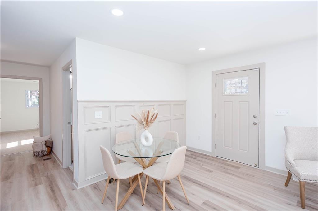 1560 North Columbia Place Decatur, GA 30032 - Photo 4 of 50 a view of a dining room with furniture and wooden floor