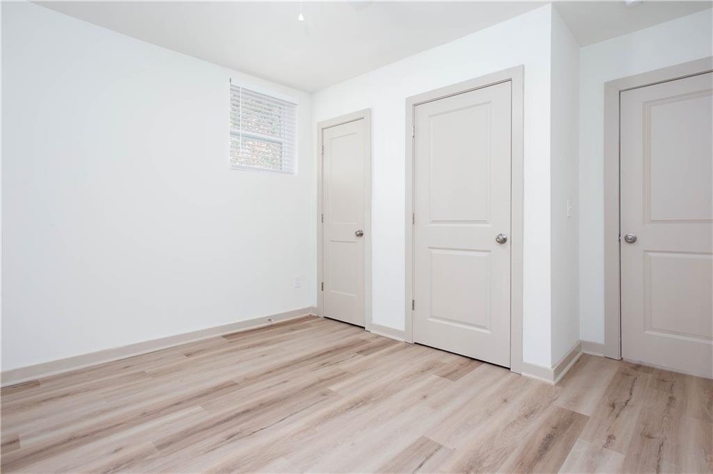 1560 North Columbia Place Decatur, GA 30032 - Photo 45 of 50 an empty room with wooden floor