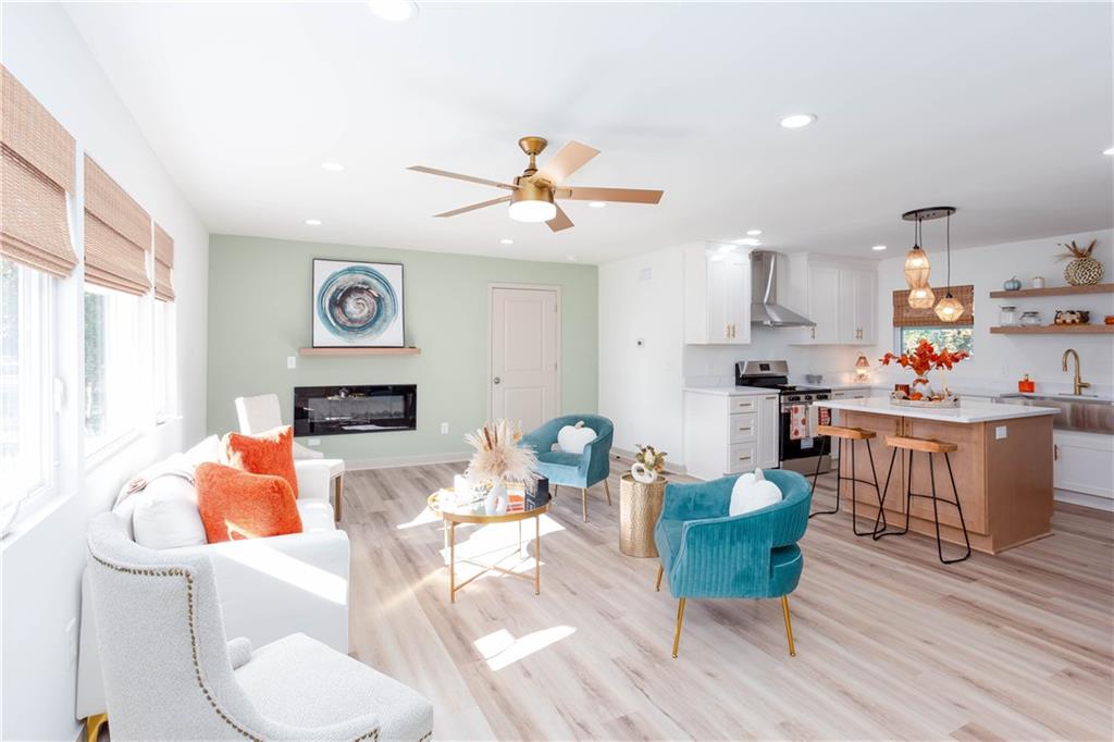 1560 North Columbia Place Decatur, GA 30032 - Photo 5 of 50 a living room with furniture and kitchen view