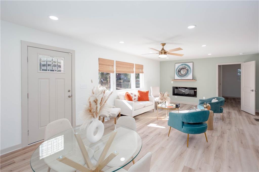 1560 North Columbia Place Decatur, GA 30032 - Photo 6 of 50 a living room with fireplace furniture and a wooden floor