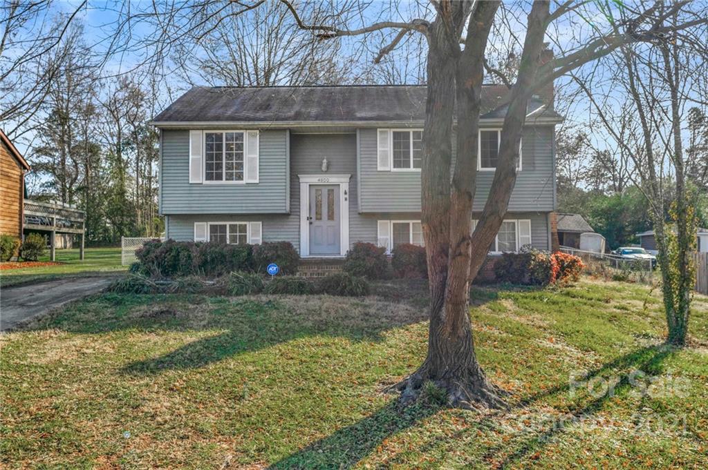 4800 Cheviot Road Charlotte, NC 28269 - Photo 2 of 34 front view of a house with a yard