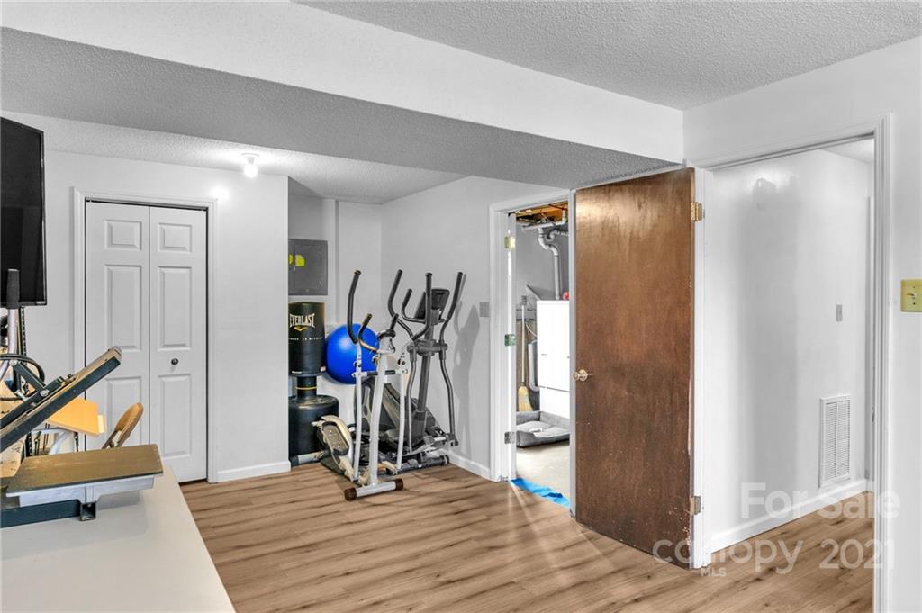 4800 Cheviot Road Charlotte, NC 28269 - Photo 24 of 34 a view of a room with wooden floor and windows