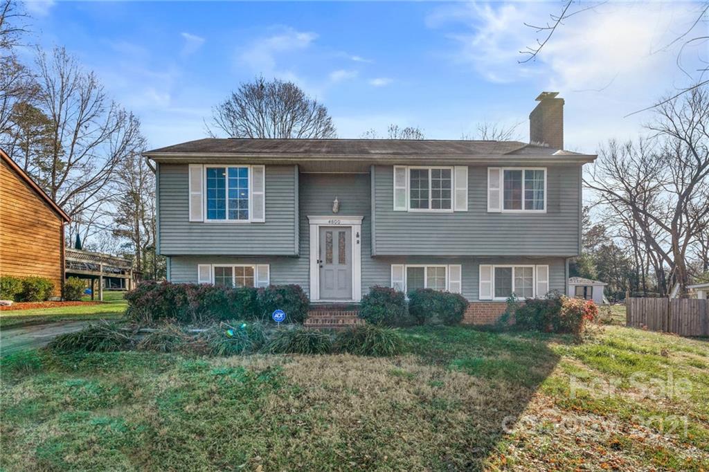 4800 Cheviot Road Charlotte, NC 28269 - Photo 3 of 34 a front view of a house with garden