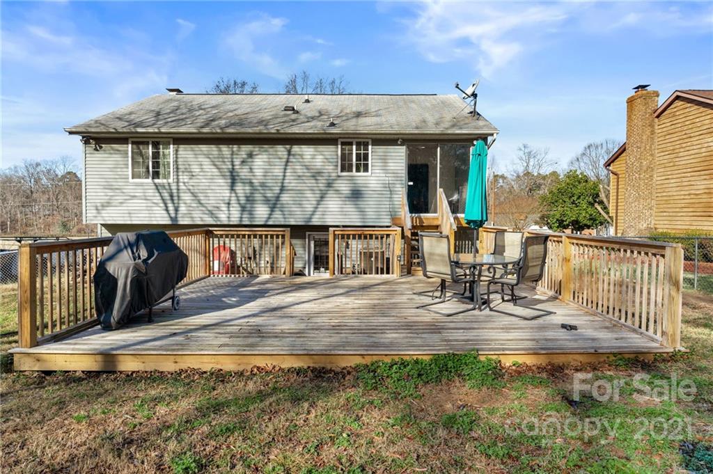 4800 Cheviot Road Charlotte, NC 28269 - Photo 33 of 34 a view of a chair and table on the deck