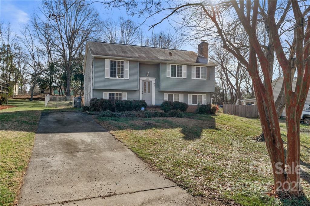 4800 Cheviot Road Charlotte, NC 28269 - Photo 4 of 34 a view of a house with a yard covered in snow
