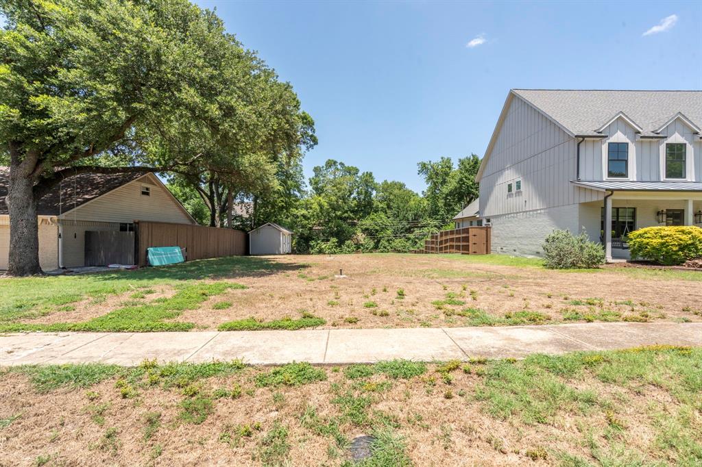 7835 Blackbird Lane Dallas, TX 75238 - Photo 1 of 1 a front view of a house with a yard