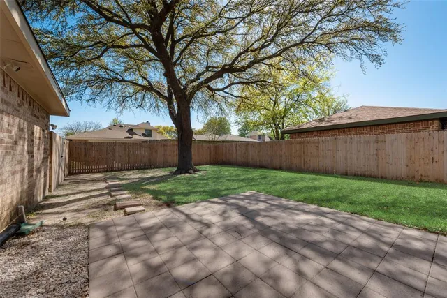 a view of backyard with green space