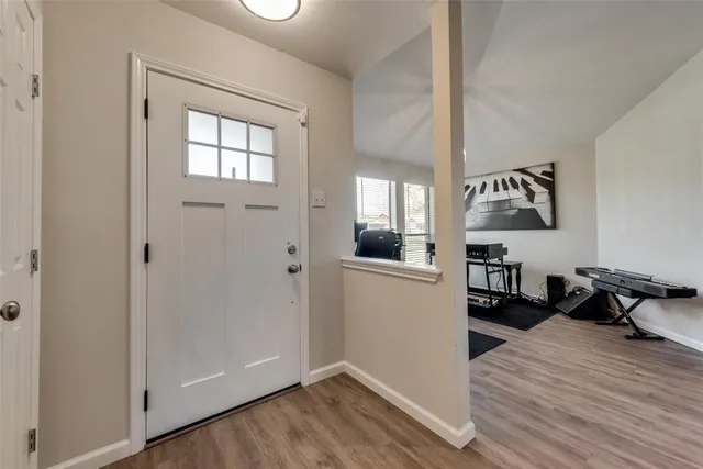a view of a living room and hardwood floor