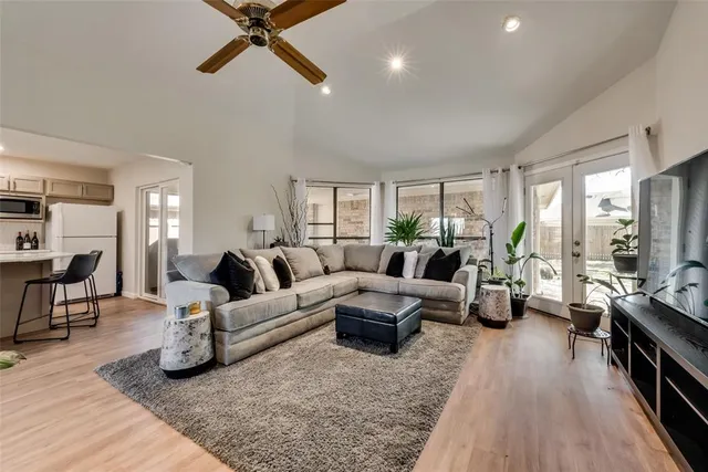 a living room with furniture or couch and a wooden floor