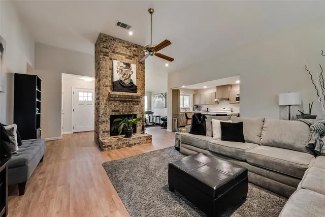 a living room with furniture and a fireplace