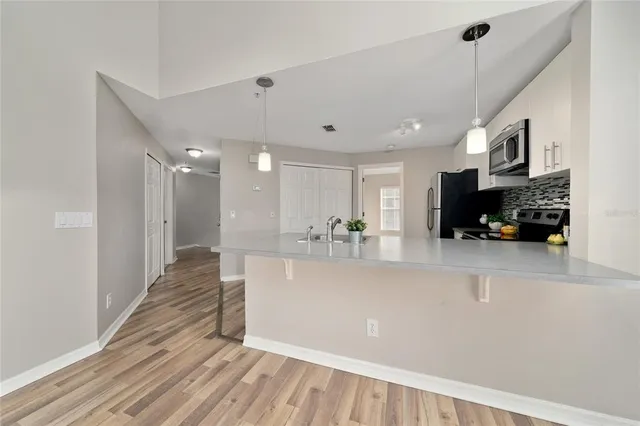 a white vase with flowers