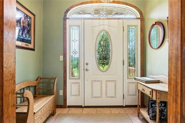 a view of a hallway with closet and livingroom