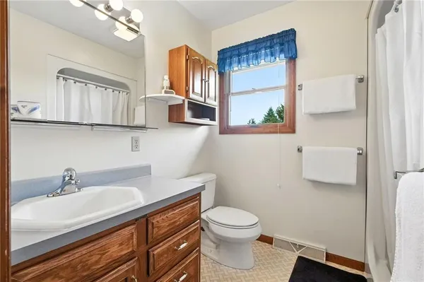 a bedroom with bed and window