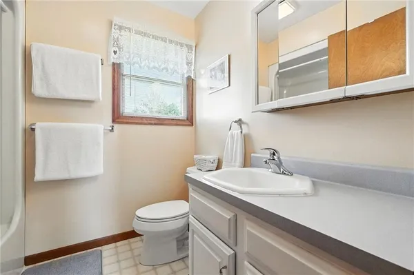 a kitchen with kitchen island a sink dining table and chairs