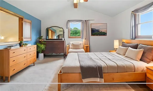 a view of living room with furniture and a window