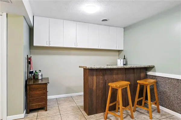 a view of wooden deck and a garden
