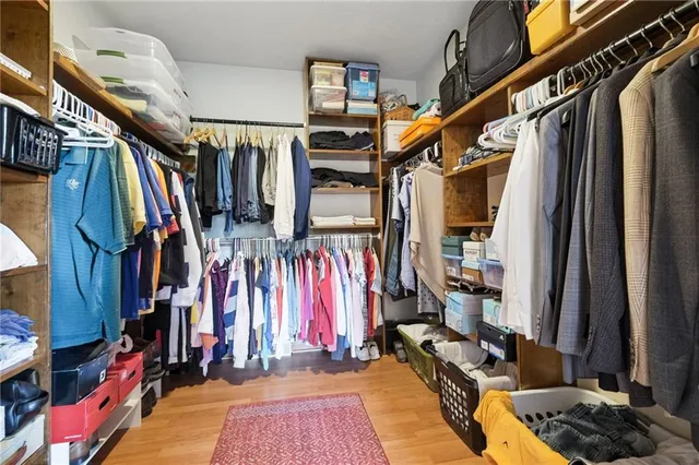 a bedroom with a bed chair and a window