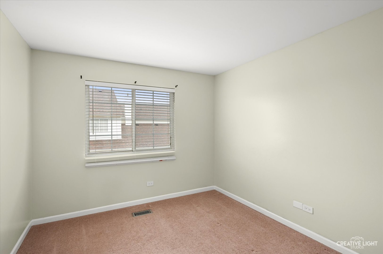 179 Azalea Circle, Unit 179 Romeoville, IL 60446 - Photo 11 of 16 an empty room with a window