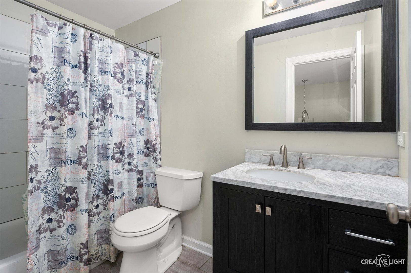 179 Azalea Circle, Unit 179 Romeoville, IL 60446 - Photo 13 of 16 a bathroom with a granite countertop sink a toilet and a mirror