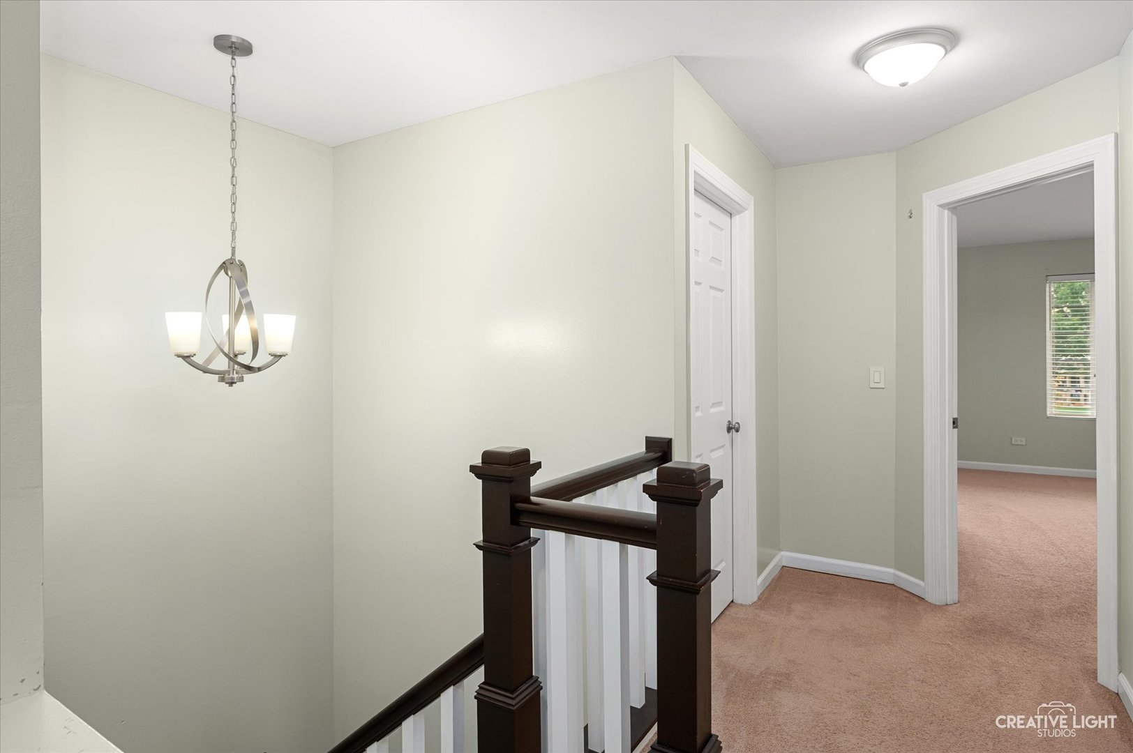 179 Azalea Circle, Unit 179 Romeoville, IL 60446 - Photo 14 of 16 a view of a hallway with a small space